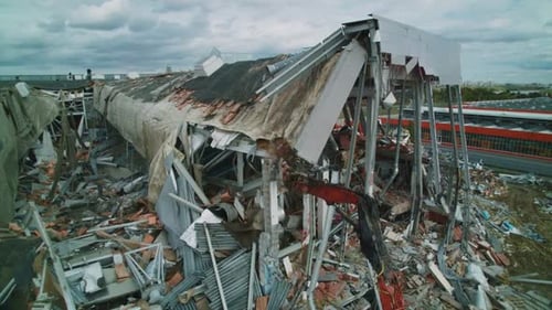 Excavator with Automatic Arm Destroys Roof of Hockey Arena