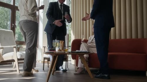 Business Colleagues Discussing Project in Hotel Lounge