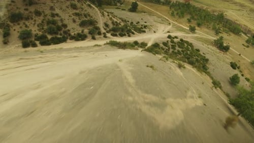 Dirt Motocross Tracks and Van in Hilly Valley Fpv