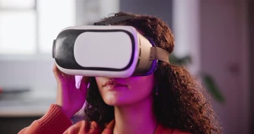 Woman Uses Virtual Reality Headset in Home