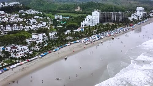 Beachgoers At The Resort At Casablanca Beach In Same, Ecuador. aerial