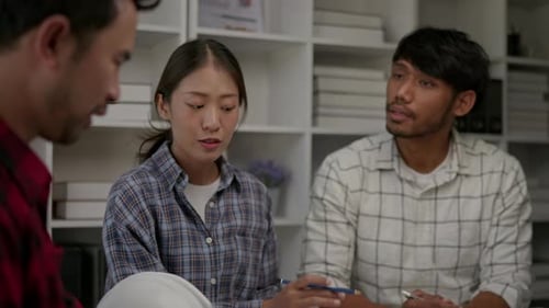 Hands working brainstorming and measuring for cost estimating on architectural and engineering.