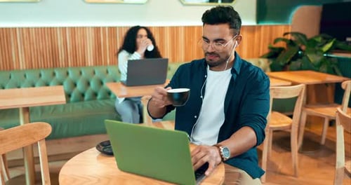 Laptop, coffee shop drink and happy man typing, reading or check online report