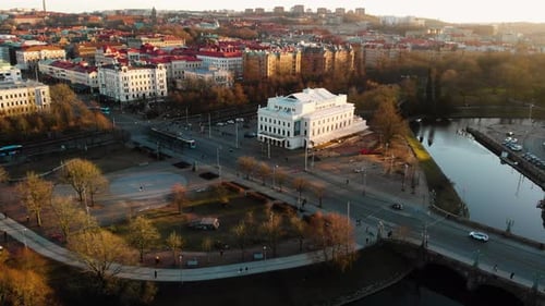 Aerial establishing shot of Stora Teatern theatre with old European architecture in Gothenburg. Peop