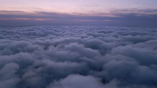 Fluffy Clouds at Sunrise From Above