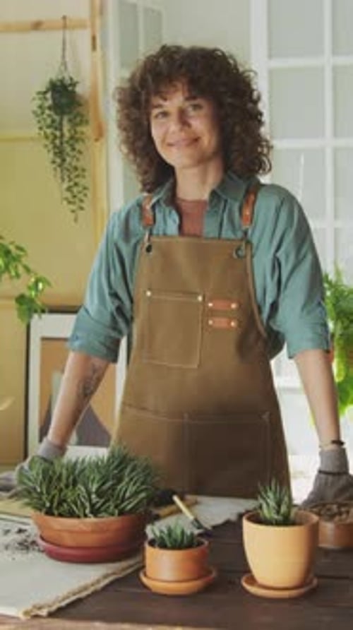 Happy Woman with Houseplants Indoors