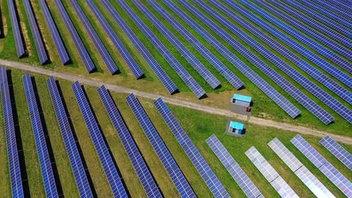 Huge solar power plant. Blue photovoltaic panels of a solar farm.