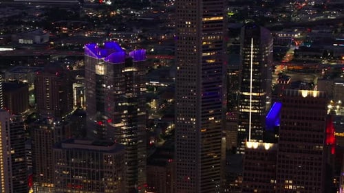 Vibrant City Lights and Architectural Highlights of Houston's Illuminated Skyline at Night in This