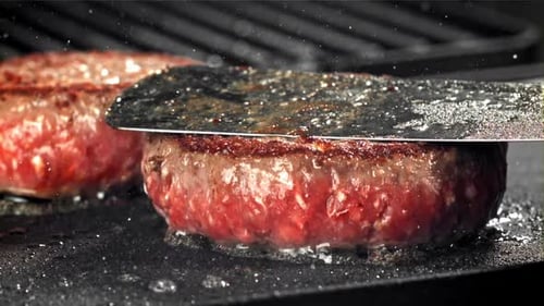 A Burger Made From Natural Meat is Fried in a Frying Pan Filmed on a Highspeed Camera at 1000 Fps
