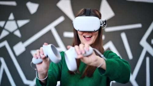 Woman Enjoys Virtual Reality Headset Experience with Controllers