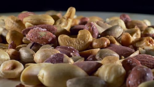 Pile of Mixed Nuts with Hand Picking