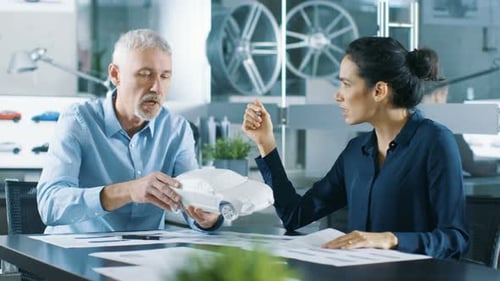 Experienced Automotive Designer and Female Engineer Works with a Concept Car Prototype Model, Perfe