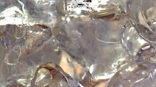 Macro Shot of Ice Cubes in Clear Liquid