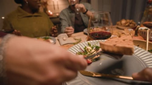 Friends Enjoying Pumpkin Pie at Cozy Dinner Gathering