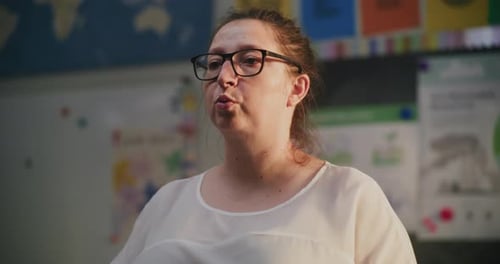 Teacher Explaining in Classroom Setting