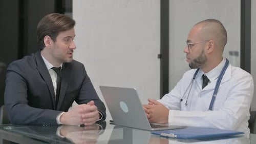 Patient Consults Doctor in Bright Modern Office