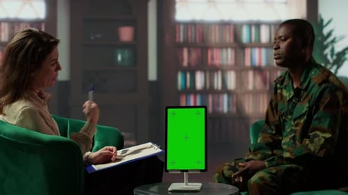Counseling Session with Soldier Using Tablet in Office