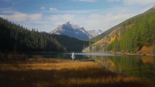 Woman spreading arms out of joy while looking at inspiring natural landscape at Vista Lake