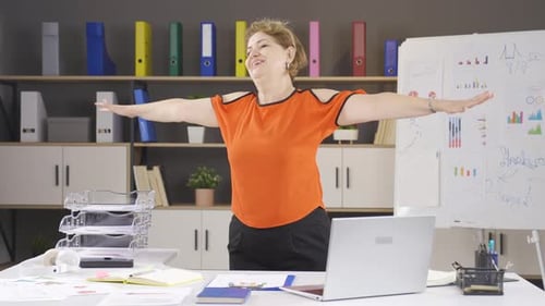 Businesswoman exercising in the office.