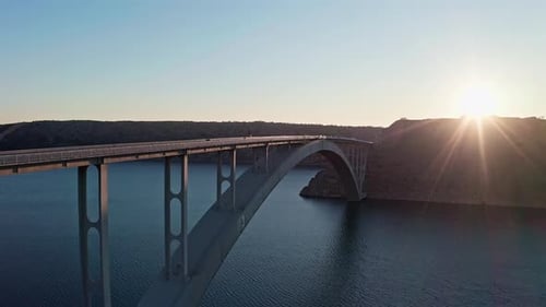 Drone shot of the bridge and ocean in the sunset 7