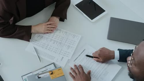 Business People Conclude Bank Deal with Handshake