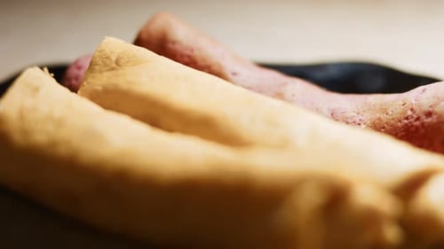 Close Up of Rolled Crepes on Plate