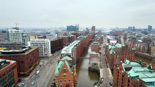 Aerial drone view of Speicherstadt in Hamburg, Germany. Classic buildings, water channels, sea port