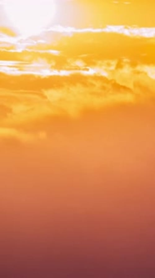 Vertical Footage Sun At Sunrise On Sky Bright Dramatic Sky With Fluffy Clouds Yellow Orange Blue And