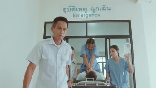 Doctors Rush Patient on Gurney for Emergency Treatment