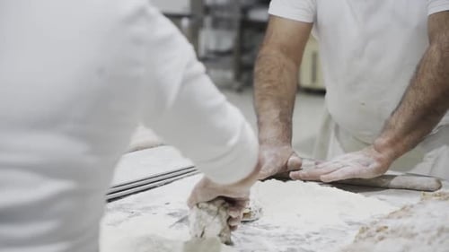 Men Shaping Bread Dough in Bakery Workplace