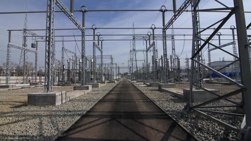 Motion Along Road Across New Substation Under Blue Sky