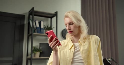 Young Adult Using Cell Phone Indoors