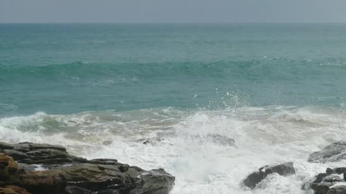 Waves Crashing on Rocky Beach Shore