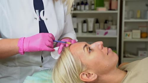 Cosmetologist Holds Syringe for Cosmetic Injections Lifting Skin Turgor Liposuction
