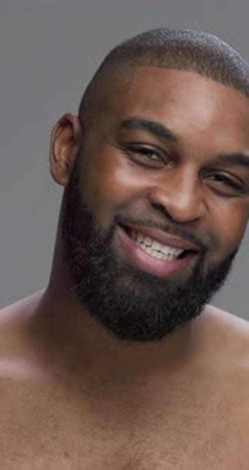 Studio, black man and face with happiness for skincare, grooming and beauty with cosmetics