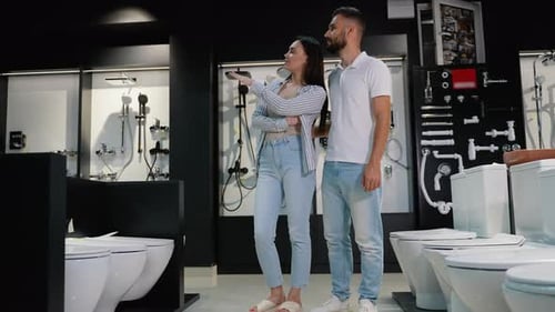 Couple Shopping for Bathroom Fixtures in Showroom