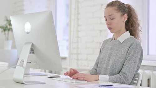 Hardworking Young Businessman using Tablet in Office