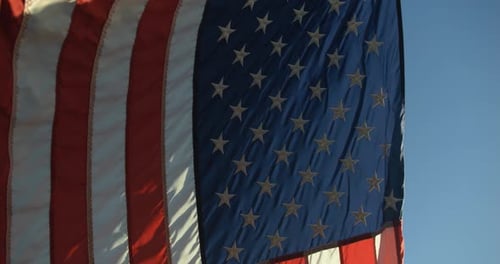 American Flag Waving Against a Blue Sky