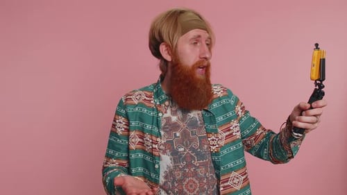 Man with Blonde Hair Vlogging with Smartphone