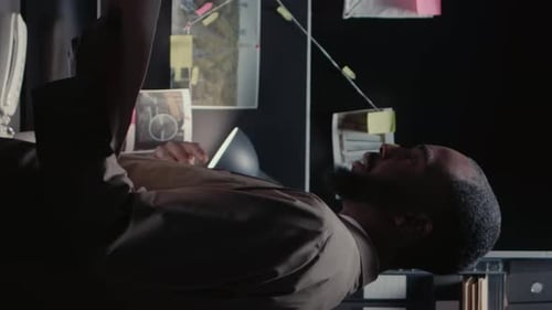 Vertical Video African American Officers Talking About Evidence in Office