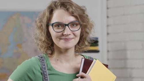 Female Teacher in Glasses in the Classroom Funny Teachers Face Young Woman Student or Teacher in