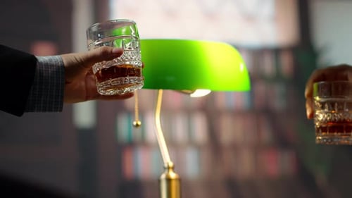 Whiskey Glasses Toasted by Banker's Lamp