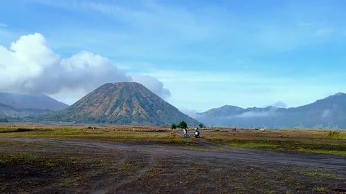 View of Bromo Tengger Semeru National Park with view of desert, savanna and mountain volcano on the