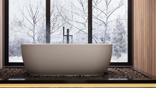 Modern Bathroom with Bathtub and Snowy Winter Landscape View