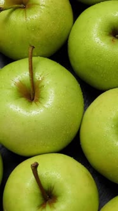 Many Green Apples Rotating Closeup Fruits Background Vertical