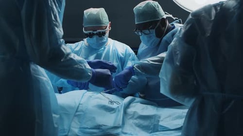 Surgeons Perform Operation in Brightly Lit Operating Room
