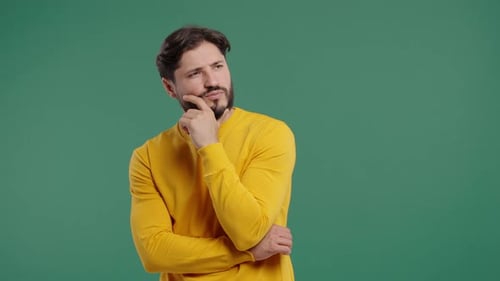 Thinking Man Looking Up Searching Opportunity On Green Background Curious