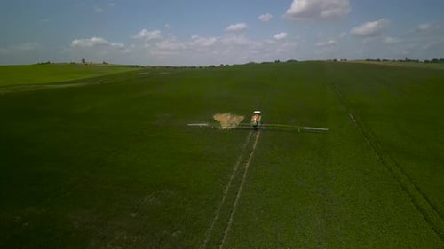 Spray Fertilize On Field With Chemicals In Agriculture Field