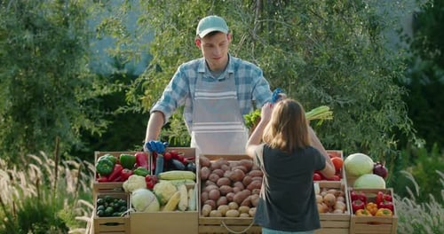 Girl Buying Vegetables at the Farmers Market