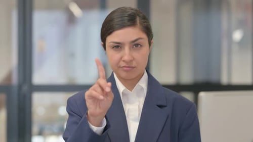 Young Woman with Dark Hair Gesturing No Rejection